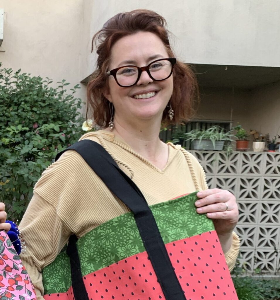 Bridgit shows off her first sewing project.