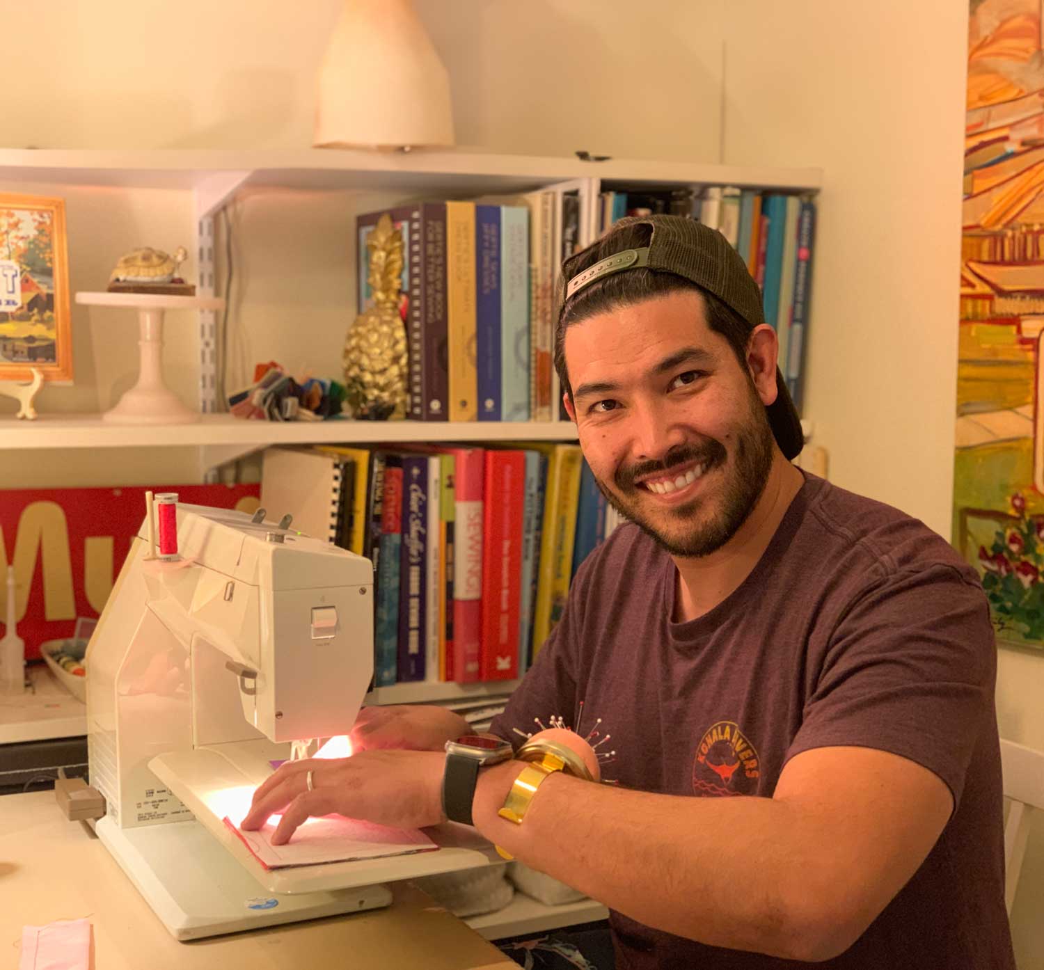 A student learns how to use a sewing machine during a beginner-friendly sewing class.