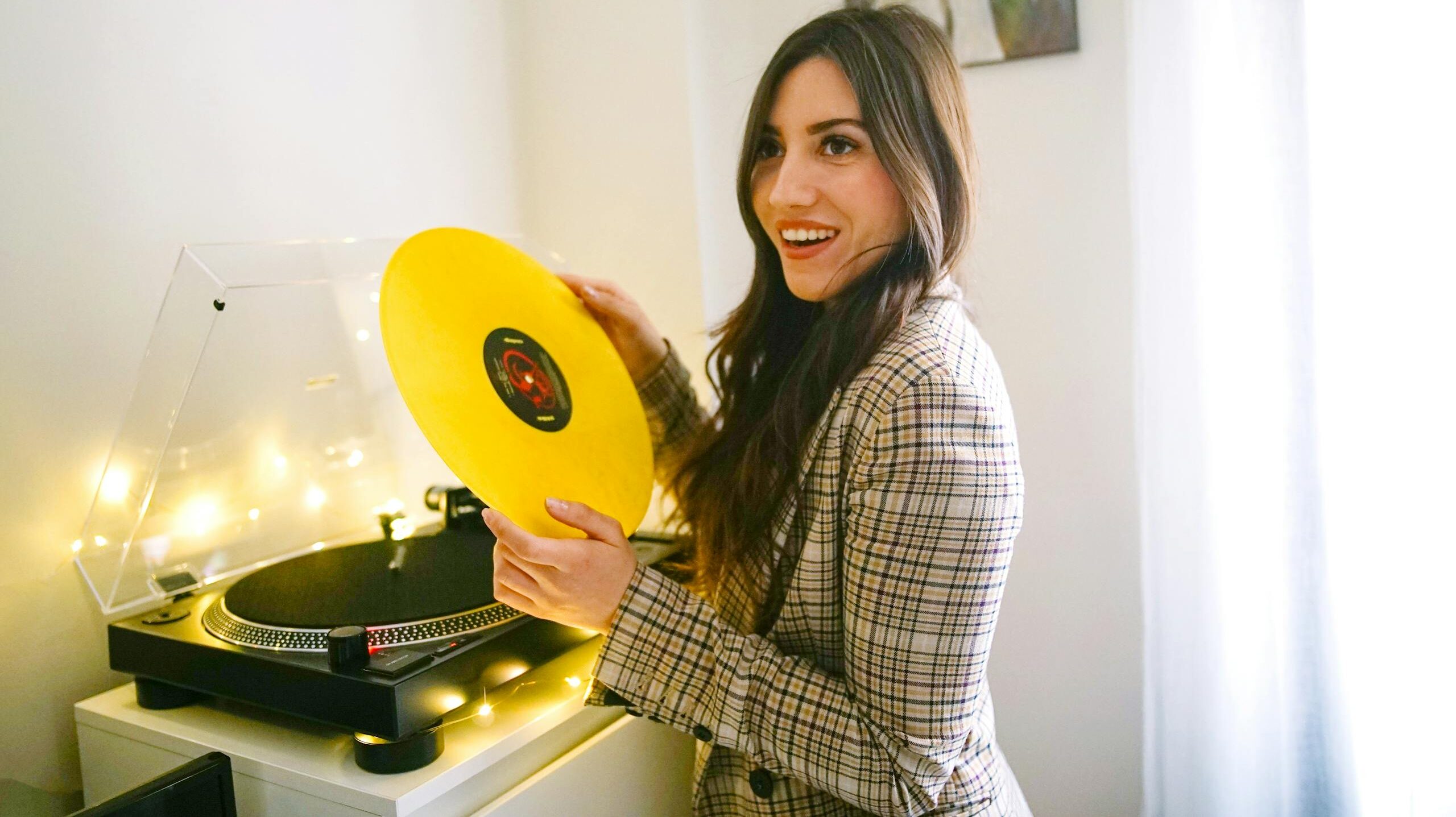 Woman Holding Yellow Vinyl Record